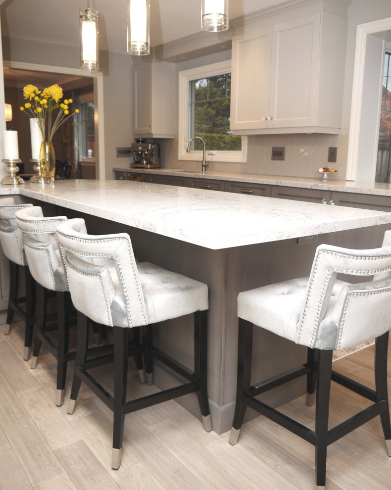 Example of a transitional kitchen design in Toronto