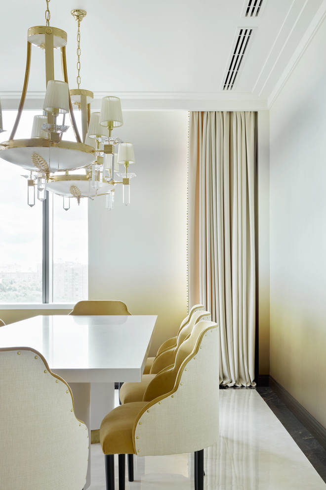 Photo of a transitional open plan dining in Moscow with beige walls.