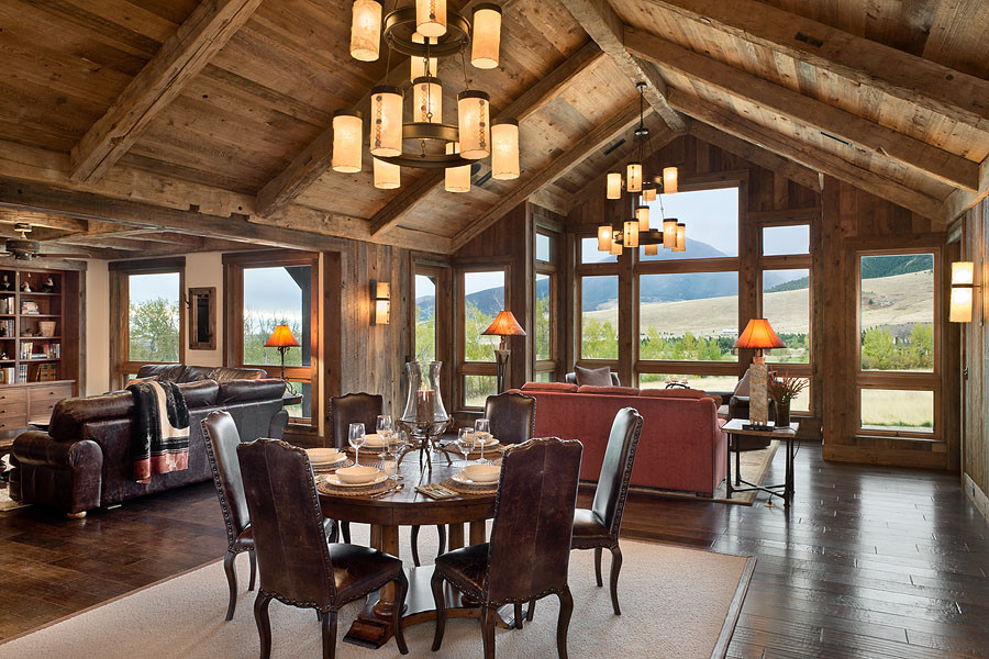 Example of a large mountain style dark wood floor great room design with multicolored walls