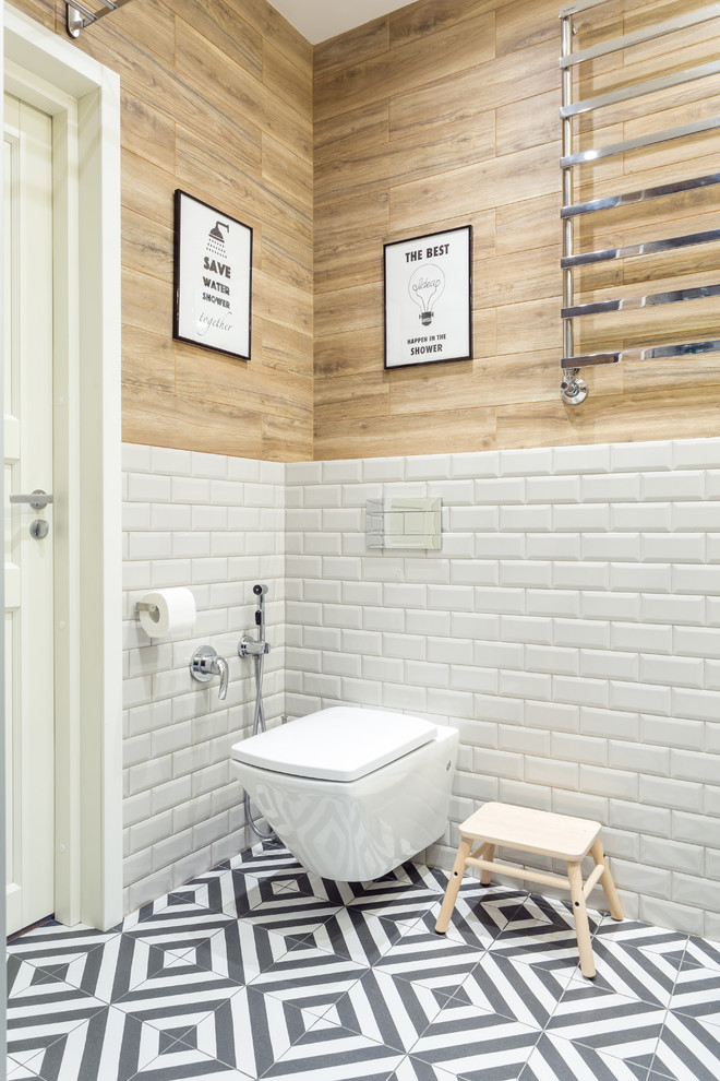 Inspiration for a mid-sized scandinavian 3/4 bathroom in Moscow with flat-panel cabinets, white cabinets, an alcove shower, a wall-mount toilet, white tile, ceramic tile, white walls, ceramic floors, a vessel sink, engineered quartz benchtops, black floor, a hinged shower door and grey benchtops.