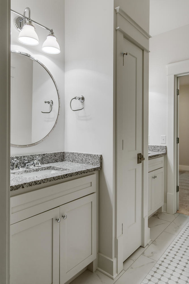 Photo of a mid-sized traditional kids bathroom in Nashville with shaker cabinets, white cabinets and granite benchtops.