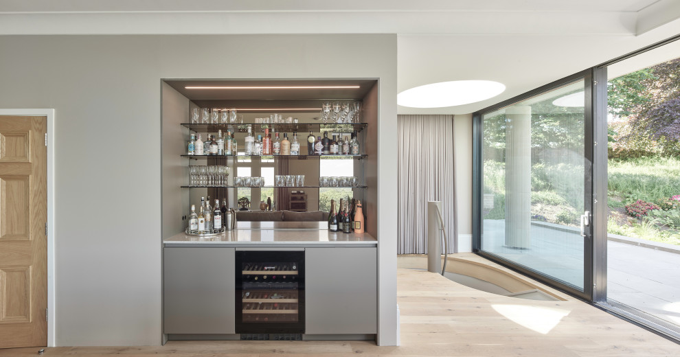 Photo of an expansive traditional home bar in Other.