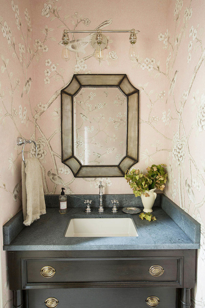 Inspiration for a small traditional powder room in Other with furniture-like cabinets, dark wood cabinets, pink walls, an undermount sink and soapstone benchtops.
