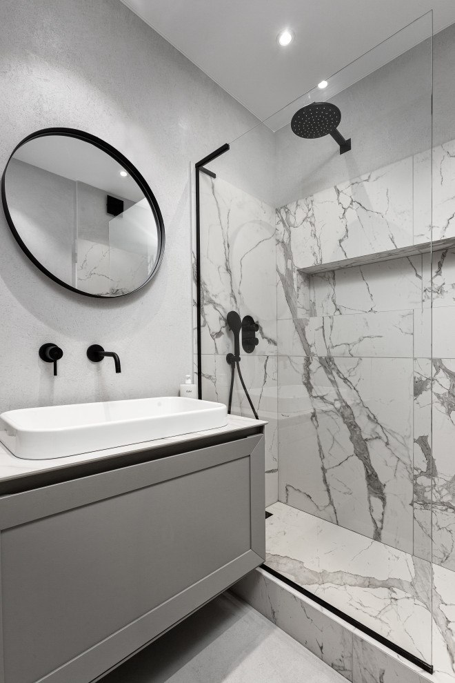 Photo of a small contemporary 3/4 bathroom in Moscow with raised-panel cabinets, grey cabinets, an open shower, porcelain tile, grey walls, cement tiles, solid surface benchtops, an open shower, white benchtops, a single vanity and a floating vanity.