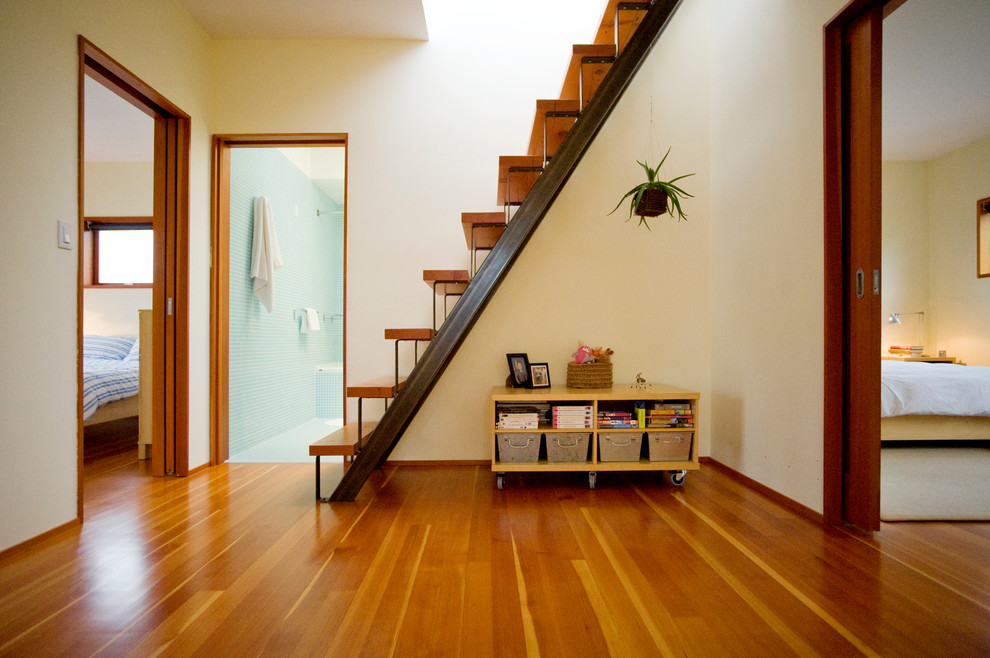 Design ideas for a contemporary hallway in Vancouver with white walls and medium hardwood floors.