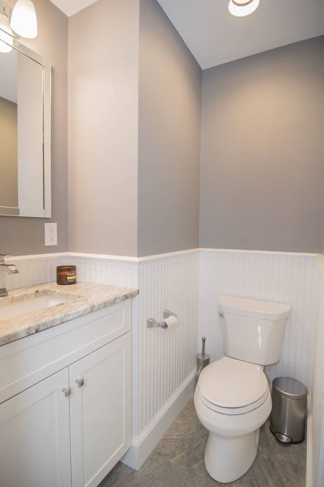 Design ideas for a small transitional powder room in Boston with shaker cabinets, white cabinets, a two-piece toilet, multi-coloured tile, grey walls, porcelain floors, an undermount sink and quartzite benchtops.