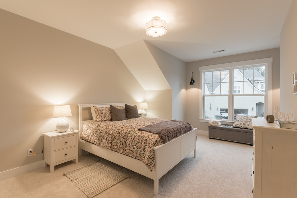 Photo of a mid-sized modern guest bedroom in Other with beige walls, carpet and beige floor.