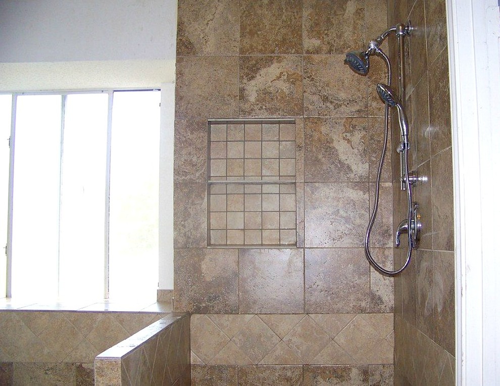 Mid-sized transitional master beige tile and ceramic tile corner shower photo in Austin with beige walls
