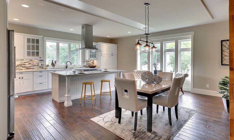 Eat-in kitchen - mid-sized transitional single-wall dark wood floor and brown floor eat-in kitchen idea in Minneapolis with shaker cabinets, white cabinets, multicolored backsplash, matchstick tile backsplash, stainless steel appliances and an island