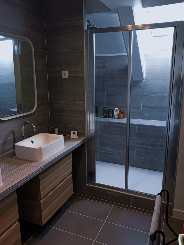 Mid-sized contemporary 3/4 bathroom in Paris with beaded inset cabinets, dark wood cabinets, a curbless shower, brown tile, ceramic tile, brown walls, ceramic floors, a trough sink, tile benchtops, brown floor, a sliding shower screen, brown benchtops, a double vanity and a floating vanity.
