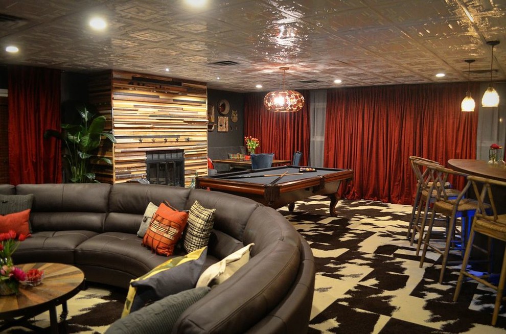Photo of a large eclectic walk-out basement in Atlanta with green walls, carpet and a standard fireplace.