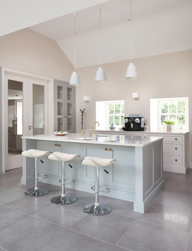 Design ideas for a large country u-shaped eat-in kitchen in Other with an integrated sink, beaded inset cabinets, white cabinets, quartzite benchtops, grey splashback, marble splashback, coloured appliances, porcelain floors, with island and grey floor.