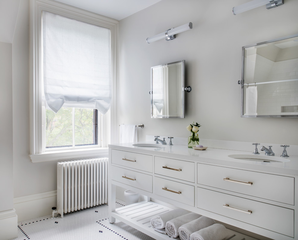 Mid-sized transitional bathroom in Boston with recessed-panel cabinets, white cabinets, white walls, ceramic floors, an undermount sink, engineered quartz benchtops and white floor.