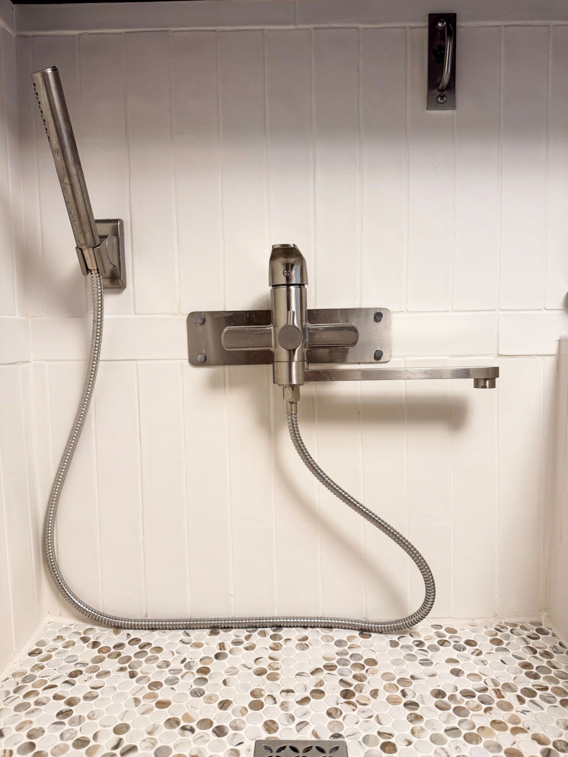 Discover how CJ Designs Denver transformed a cluttered mudroom into a bright and functional puppy spa. This renovation maximized storage, improved organization, and created a warm, welcoming space for