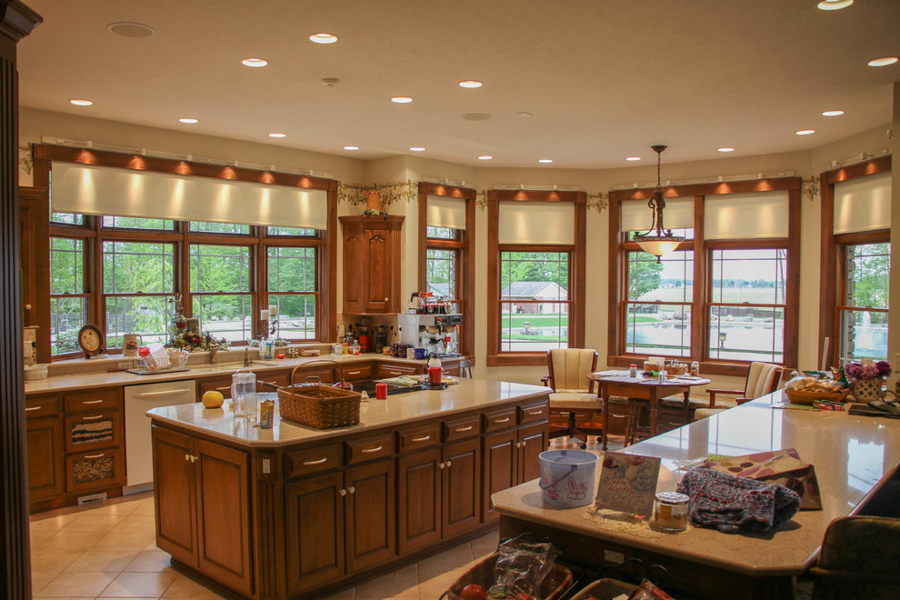 Huge mountain style u-shaped ceramic tile and beige floor eat-in kitchen photo with a double-bowl sink, dark wood cabinets, marble countertops, beige backsplash, ceramic backsplash, white appliances, an island and raised-panel cabinets