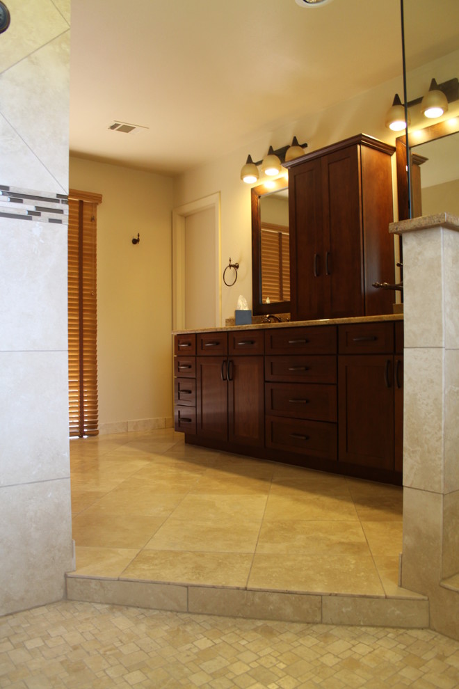Inspiration for a mid-sized traditional master bathroom in Dallas with an undermount sink, shaker cabinets, medium wood cabinets, granite benchtops, an open shower, beige tile, stone tile, beige walls, travertine floors, beige floor and an open shower.