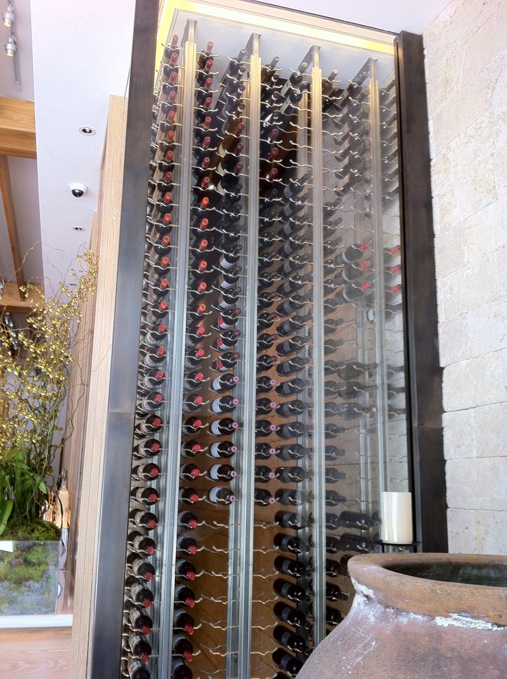 Inspiration for a small modern wine cellar in Miami with storage racks.