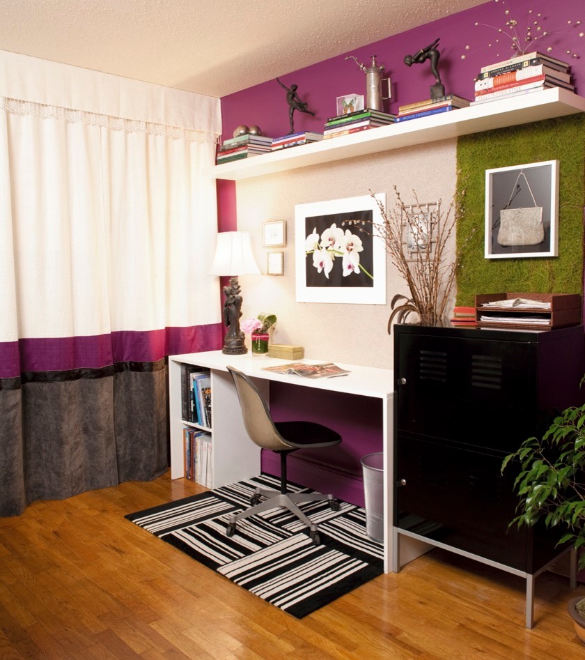 Medium sized eclectic study in New York with medium hardwood flooring, no fireplace, a freestanding desk and purple walls.