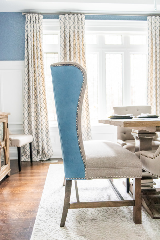 Enclosed dining room - large transitional medium tone wood floor and brown floor enclosed dining room idea in Toronto with blue walls and no fireplace