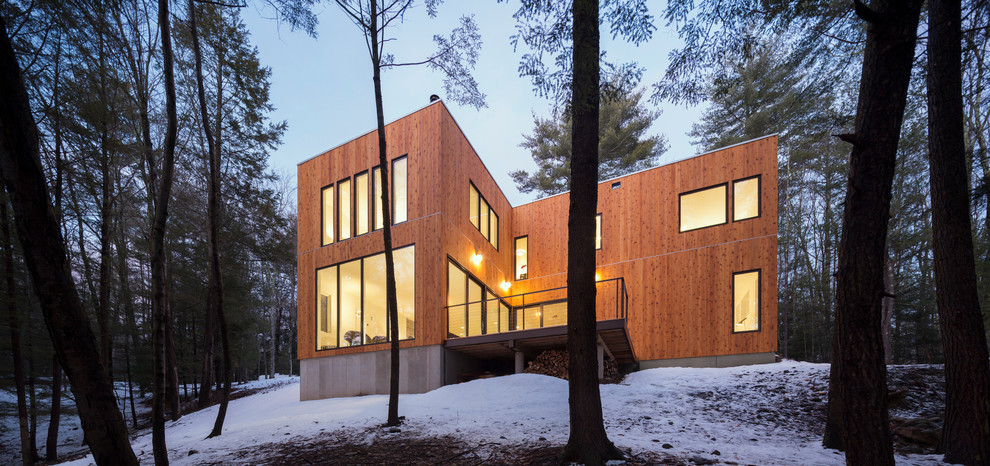 Design ideas for a contemporary exterior in New York with wood siding.
