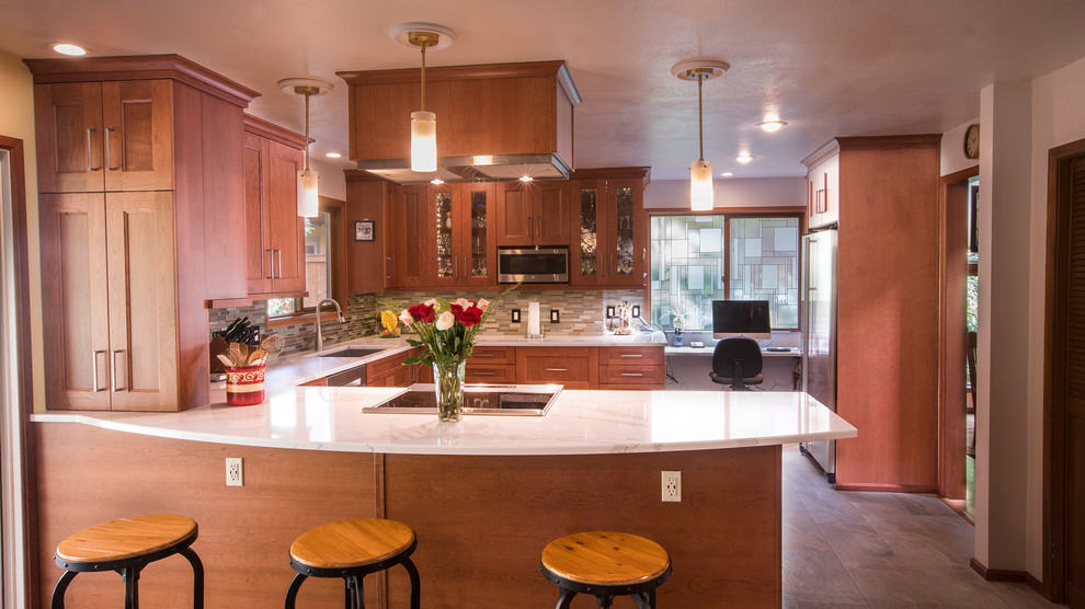 Inspiration for a huge u-shaped porcelain tile and multicolored floor eat-in kitchen remodel in Seattle with an undermount sink, shaker cabinets, medium tone wood cabinets, quartz countertops, multicolored backsplash, mosaic tile backsplash, stainless steel appliances and a peninsula