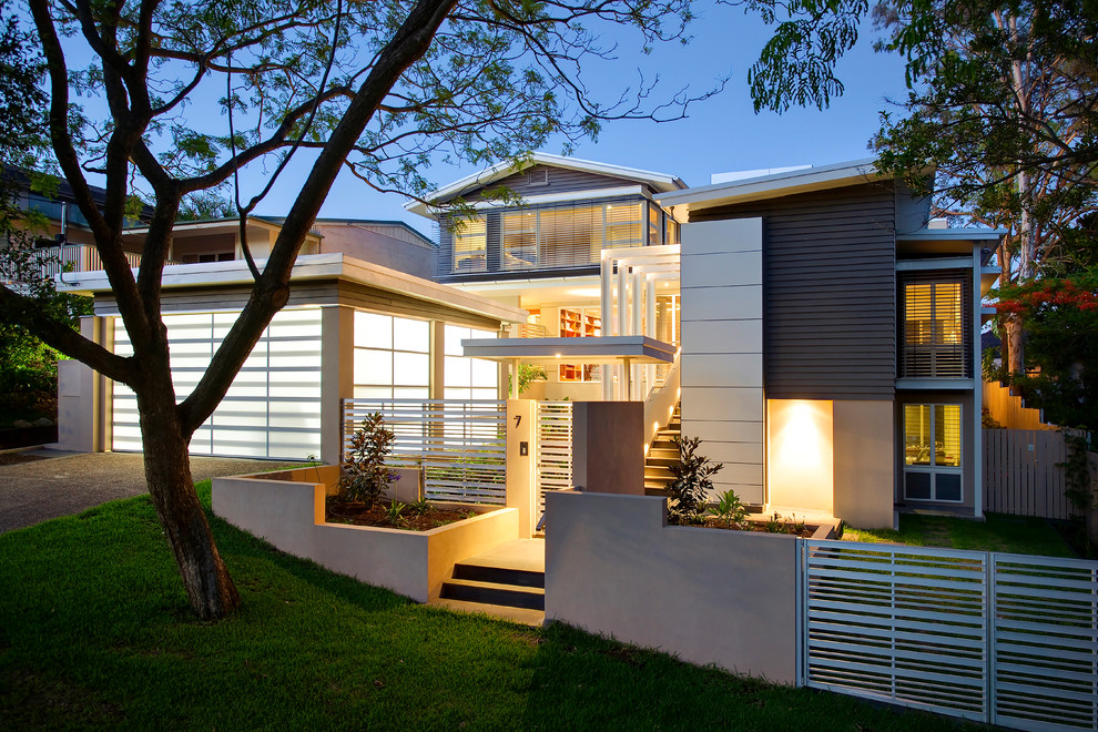 This is an example of an expansive contemporary three-storey multi-coloured house exterior in Brisbane with a metal roof.