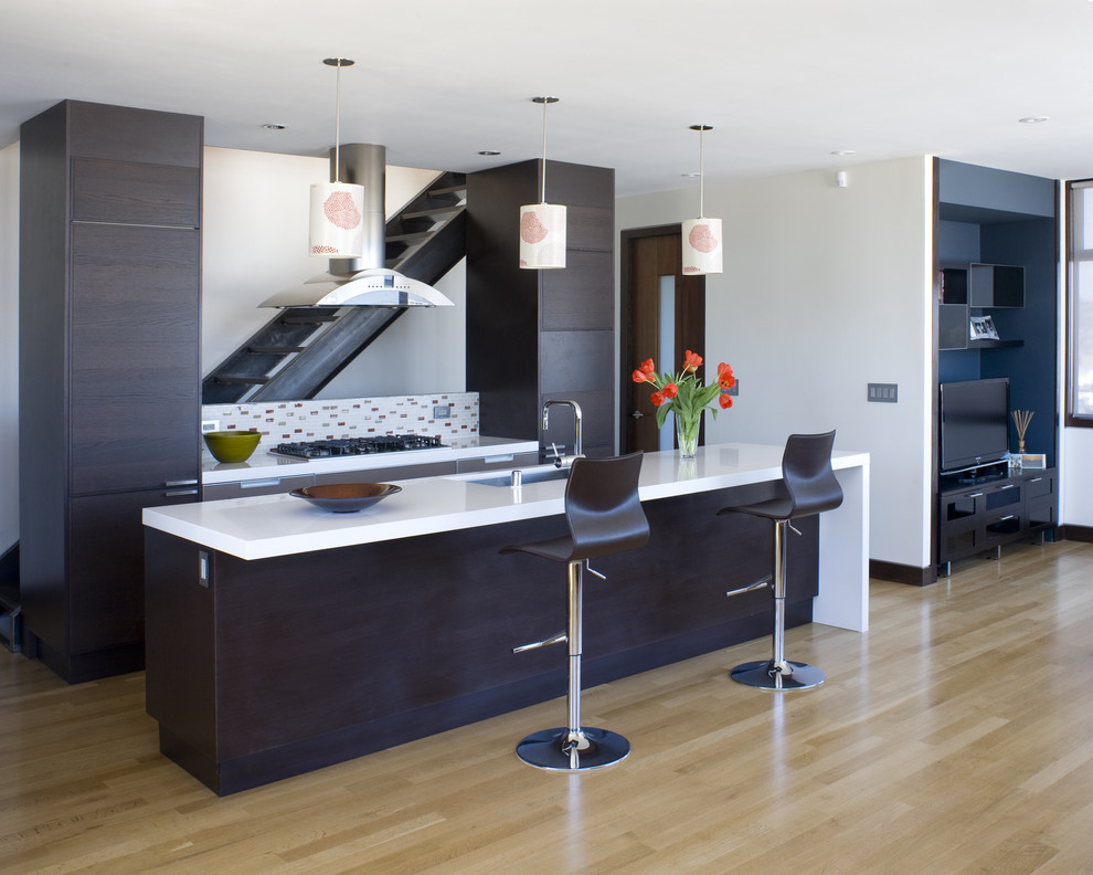 This is an example of a contemporary kitchen in San Francisco with an undermount sink, flat-panel cabinets, dark wood cabinets and multi-coloured splashback.
