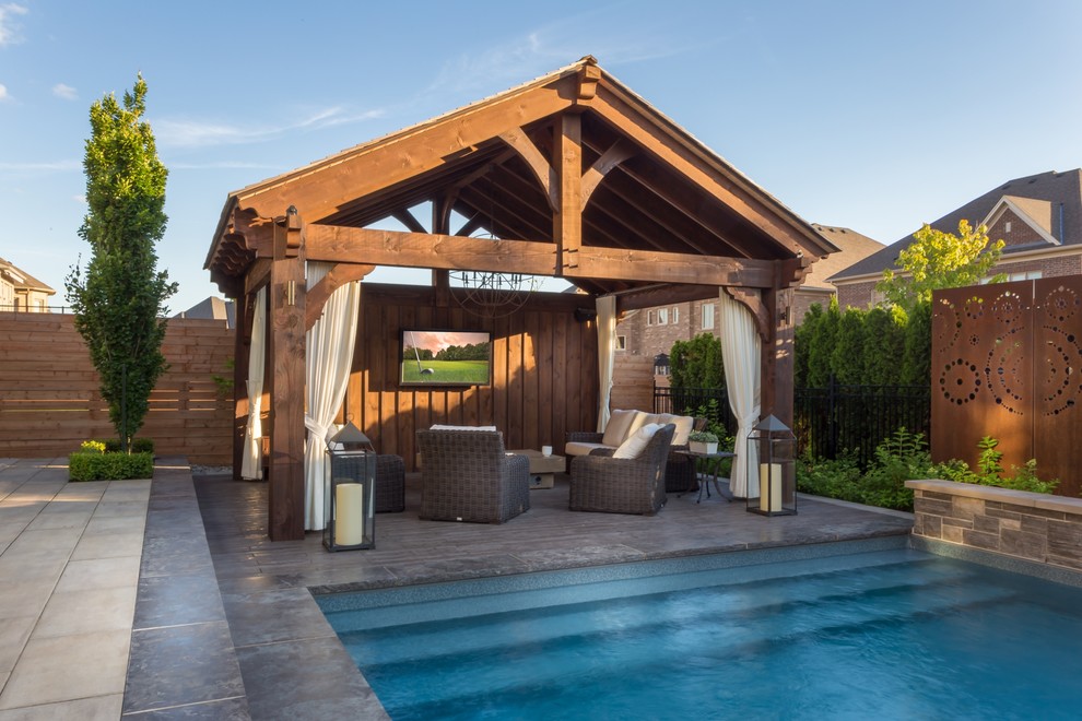 Photo of a transitional backyard landscaping in Toronto.