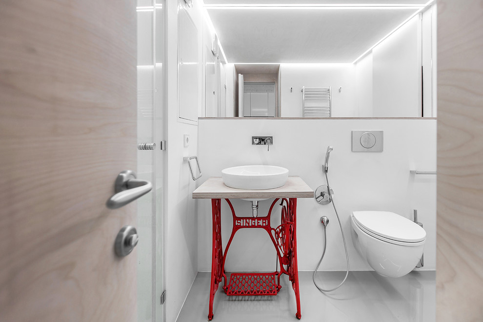 Contemporary bathroom in Moscow with open cabinets, red cabinets, a wall-mount toilet, white walls and wood benchtops.