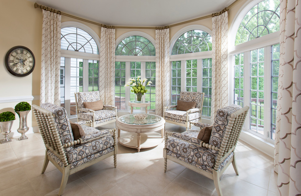 This is an example of a mid-sized traditional sunroom in Charlotte with travertine floors and a standard ceiling.