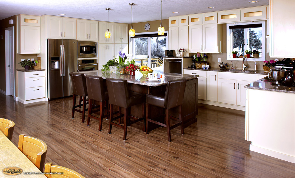 Inspiration for a rustic l-shaped light wood floor and beige floor eat-in kitchen remodel with an undermount sink, shaker cabinets, white cabinets, granite countertops, stainless steel appliances and an island