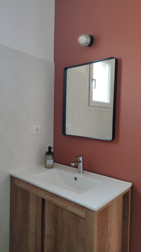 This is an example of a medium sized contemporary cloakroom in Lyon with white walls, a console sink, white worktops, light wood cabinets, ceramic flooring and beige floors.