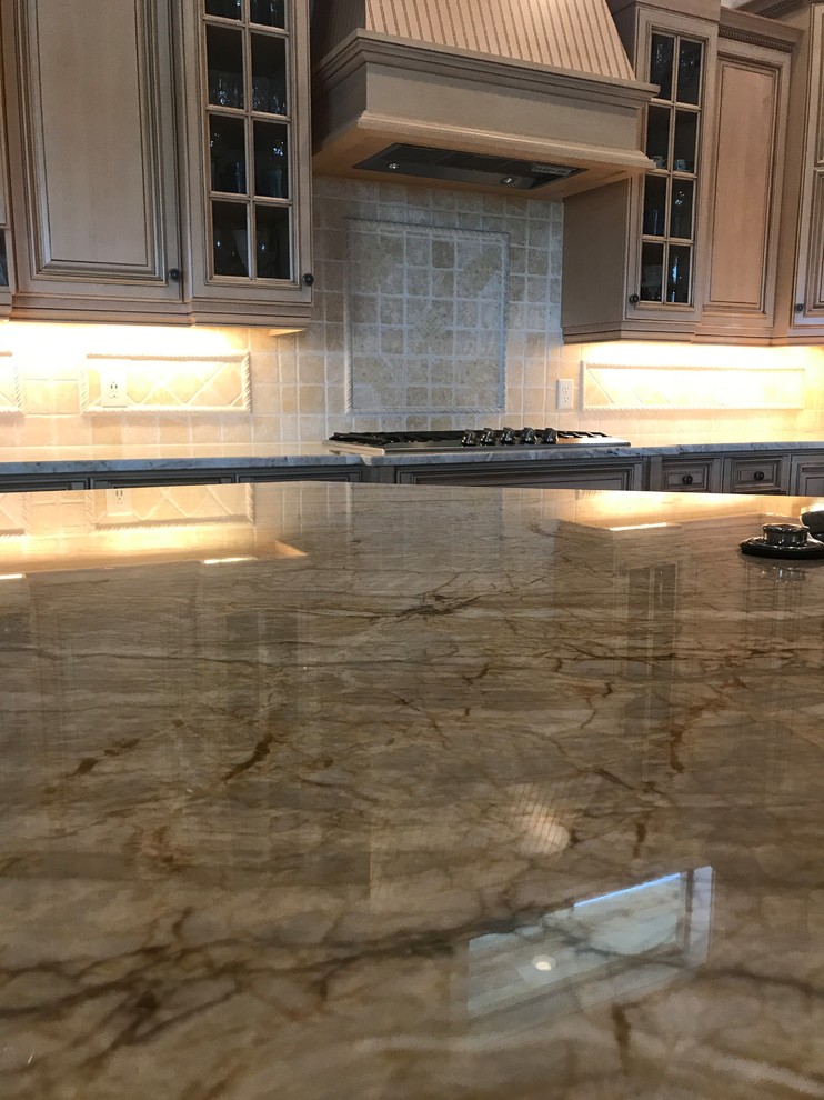 Kitchen - mid-sized transitional l-shaped brown floor kitchen idea in Miami with an undermount sink, raised-panel cabinets, light wood cabinets, paneled appliances and an island
