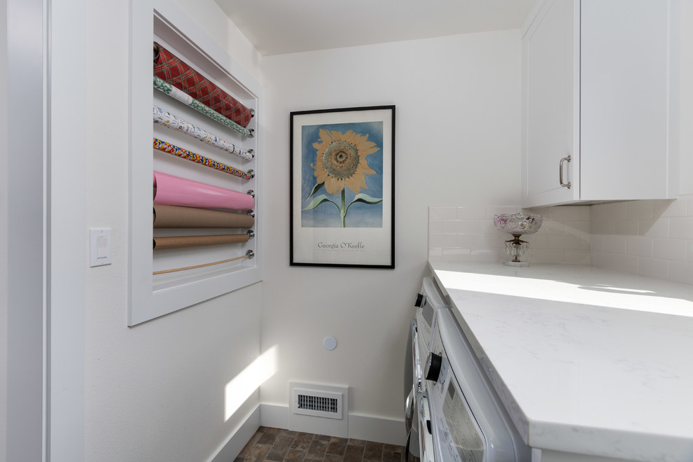 Photo of a mid-sized country l-shaped dedicated laundry room in Seattle with an undermount sink, shaker cabinets, white cabinets, quartz benchtops, white walls, brick floors, a side-by-side washer and dryer, grey floor and white benchtop.