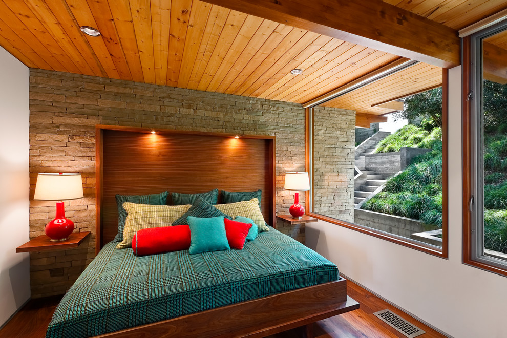 Photo of a contemporary bedroom in Santa Barbara with medium hardwood floors.