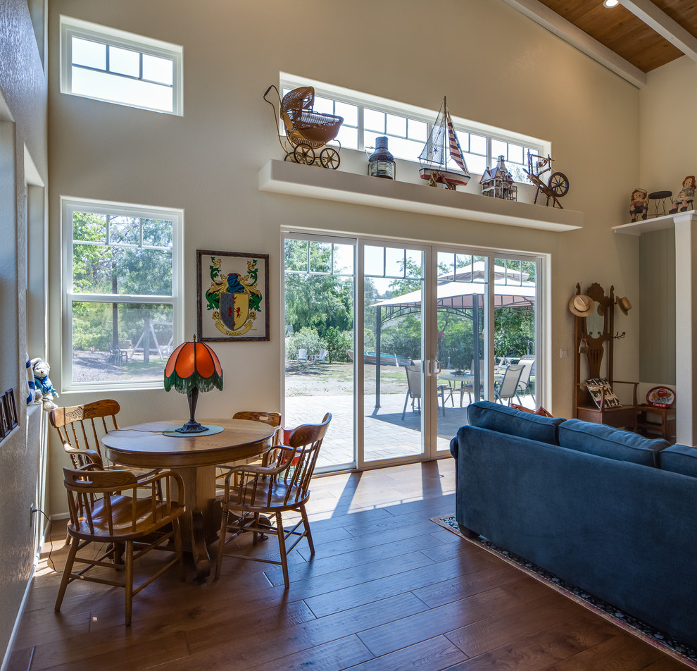 Large traditional open concept family room in San Diego with beige walls and medium hardwood floors.
