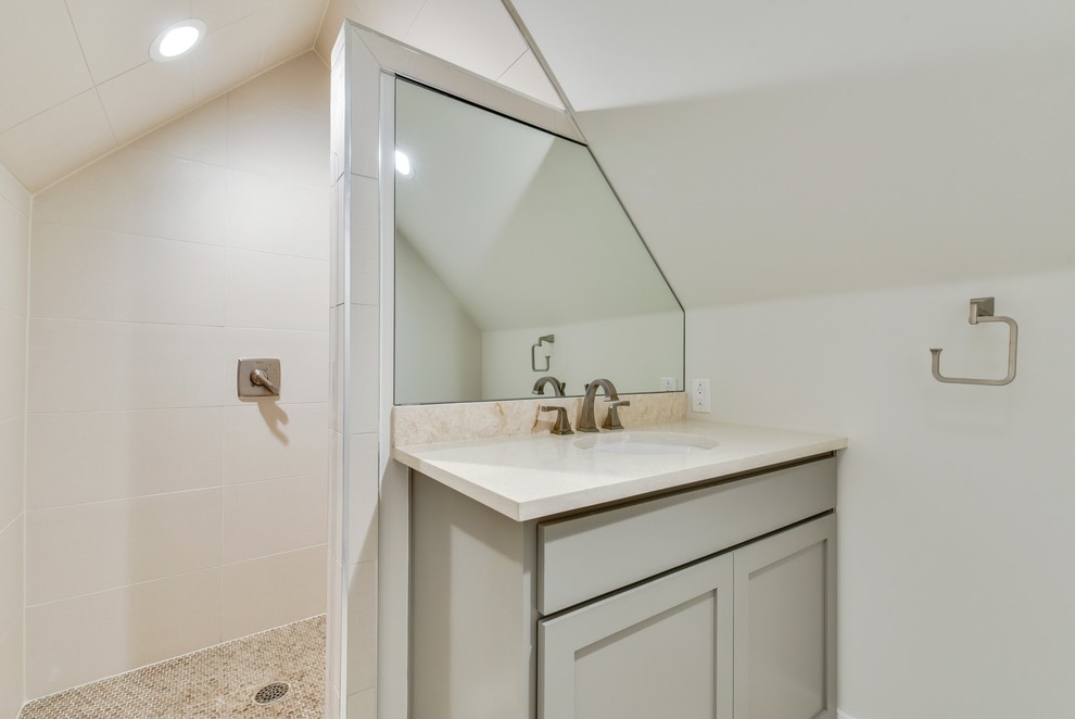 Photo of a small transitional 3/4 bathroom in Austin with shaker cabinets, grey cabinets, an open shower, a two-piece toilet, white tile, ceramic tile, white walls, ceramic floors, a wall-mount sink, granite benchtops, beige floor, an open shower and beige benchtops.