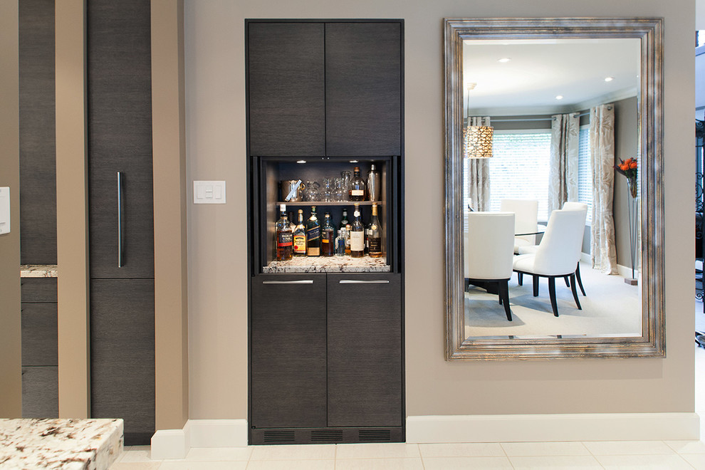 Example of a transitional home design design in Vancouver