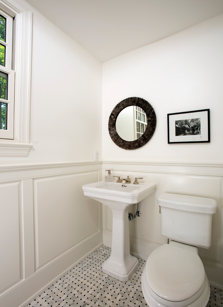 Photo of a small traditional powder room in DC Metro with a two-piece toilet, gray tile, white tile, white walls, marble floors and a pedestal sink.
