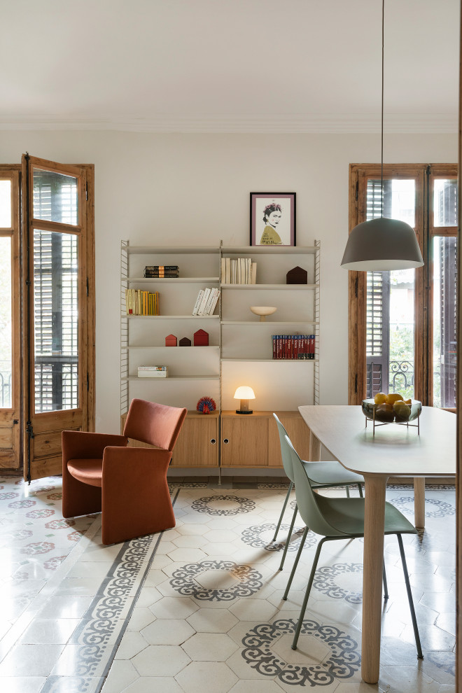 This is an example of a contemporary open plan dining room in Barcelona with beige walls and ceramic flooring.