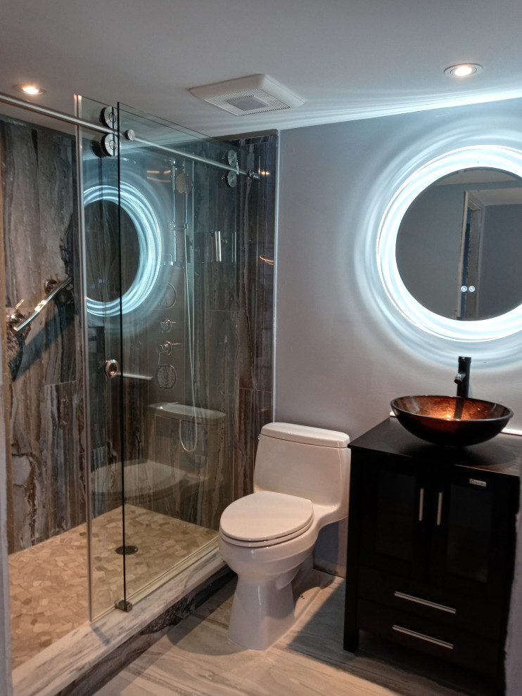 На фото: ванная комната среднего размера в стиле модернизм с коричневыми фасадами, серой плиткой, душевой кабиной, коричневой столешницей, тумбой под одну раковину и встроенной тумбой