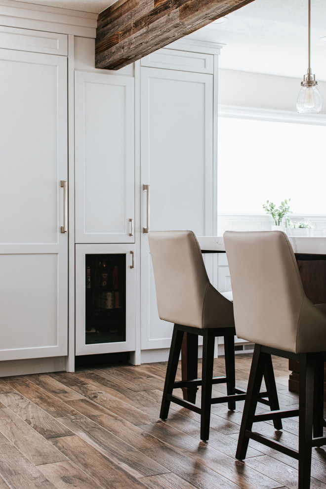 Example of a transitional kitchen design in Denver