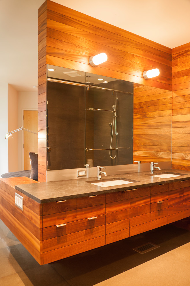 Mid-sized country master bathroom in Seattle with flat-panel cabinets, an alcove shower, a one-piece toilet, brown walls, cement tiles, an undermount sink, beige floor, concrete benchtops, medium wood cabinets, a drop-in tub, grey benchtops and a sliding shower screen.