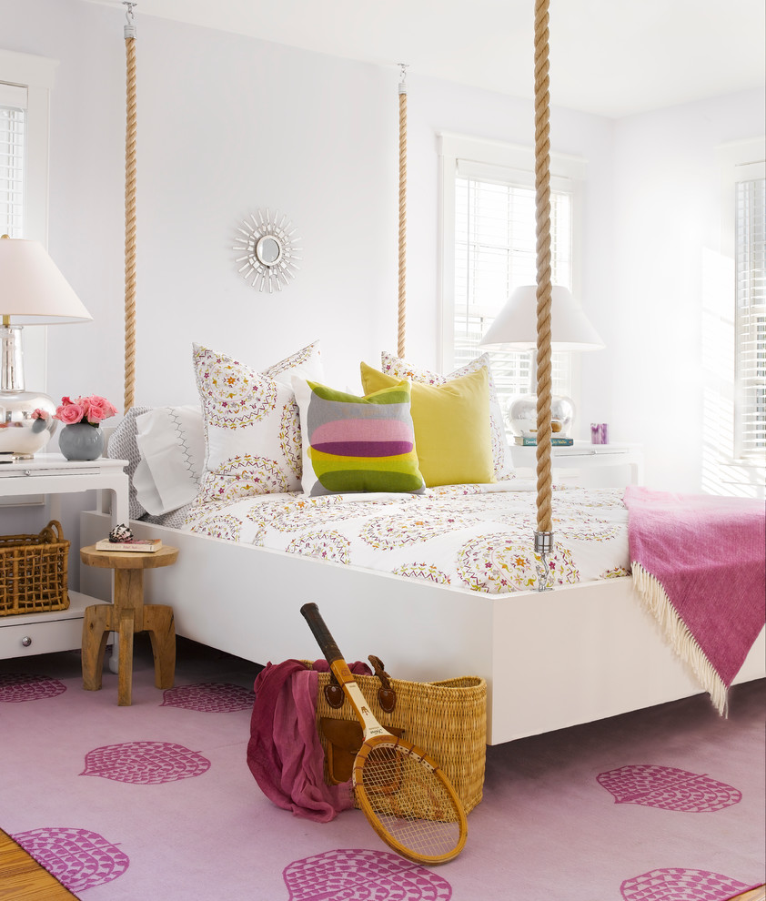 Inspiration for a mid-sized beach style kids' room for girls in Boston with white walls.