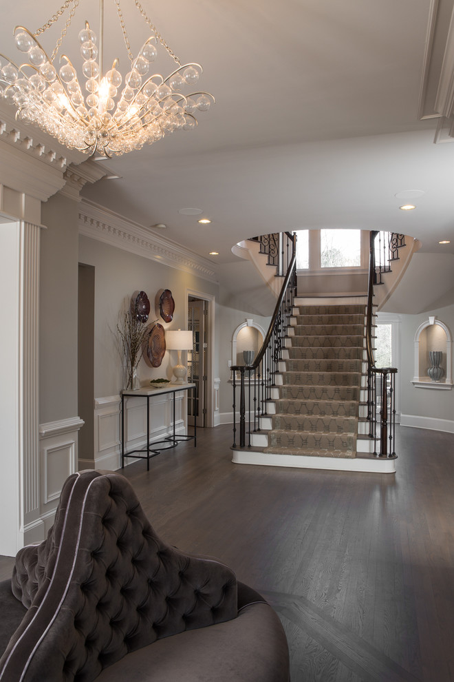 Example of a large transitional staircase design in Atlanta