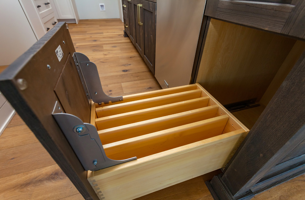 Example of a huge transitional l-shaped medium tone wood floor and brown floor open concept kitchen design with an undermount sink, shaker cabinets, white cabinets, marble countertops, multicolored backsplash, porcelain backsplash, stainless steel appliances, an island and white countertops