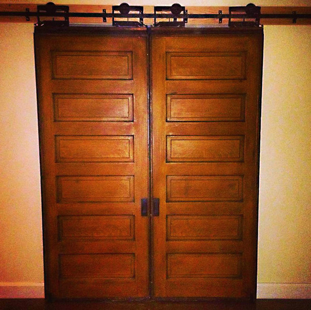 Restored farmhouse door with original antique pocket door sliders