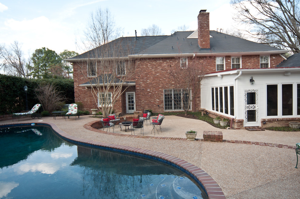 Large backyard kidney-shaped natural pool photo