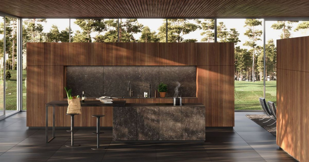 Cette image montre une grande cuisine minimaliste en bois brun avec un placard à porte plane et îlot.