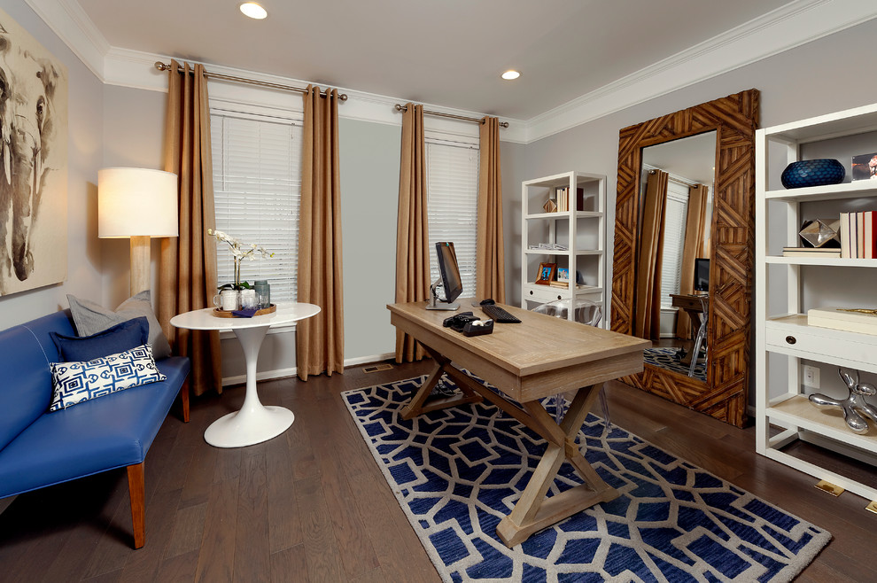 This is an example of a traditional home office in DC Metro with grey walls.